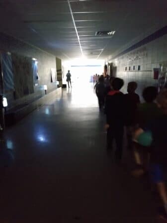 A darkened hallway of a school during a blackout