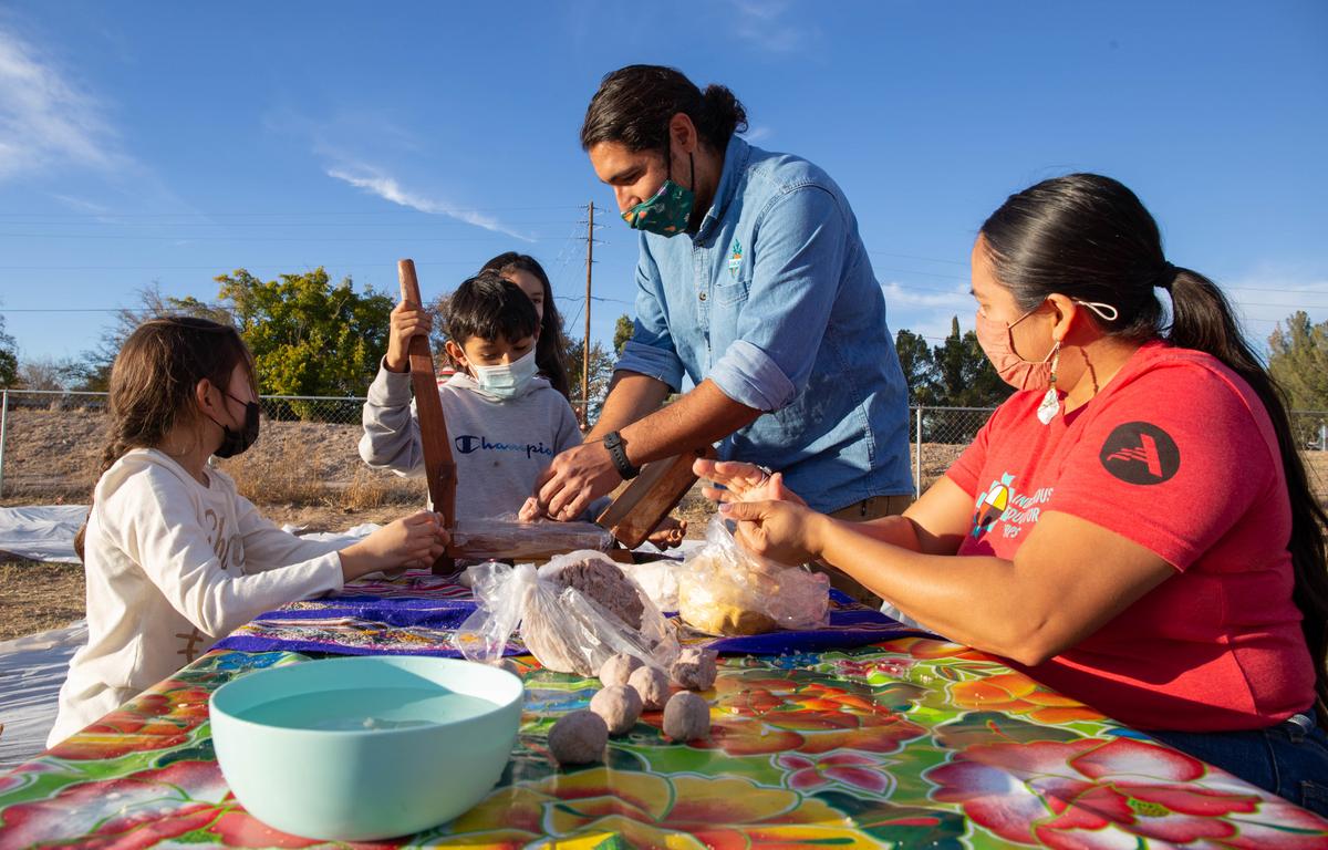 Luis helps students press their tortillas during a cooking class in Las Cruces, New Mexico. Photo by Ro Li.