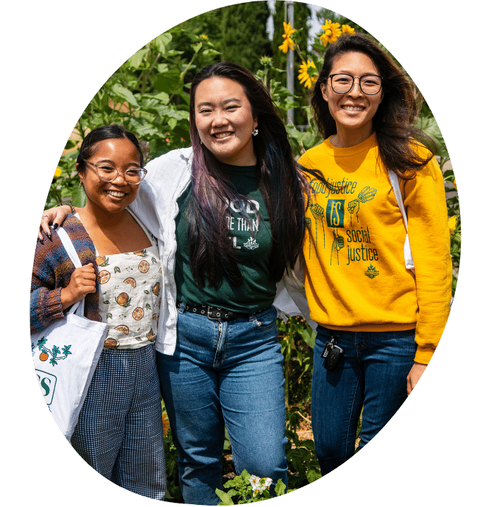 Three members of FOLCS stand together, smiling