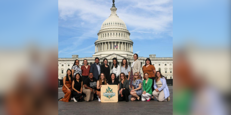 A large group of FoodCorps alumni and staff pose in from of the Capitol after a visit spent focusing on school food policy advocacy.