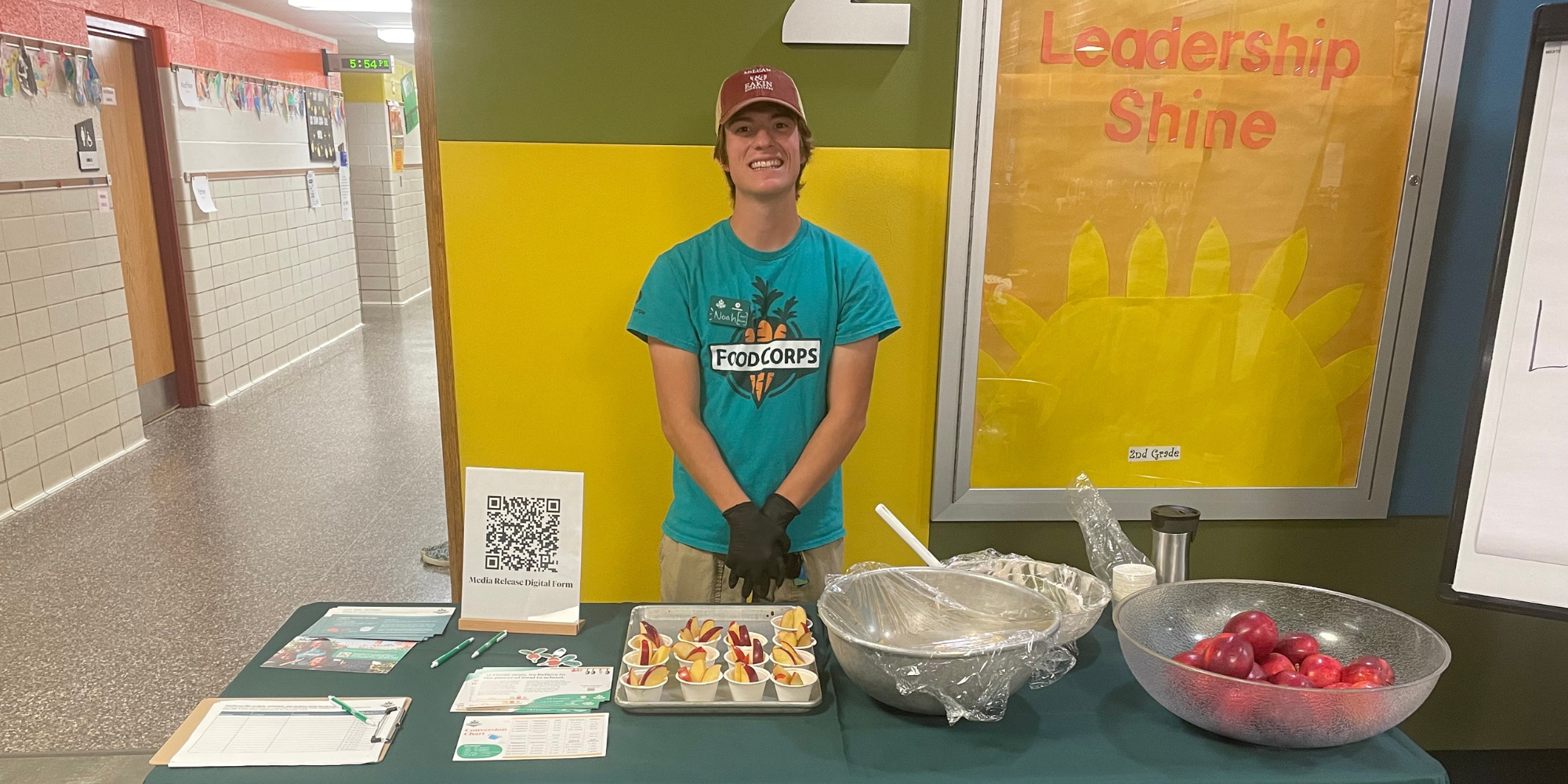 Noah Doederlein, standing at a taste test table, shares a day in the life of a school nutrition member.